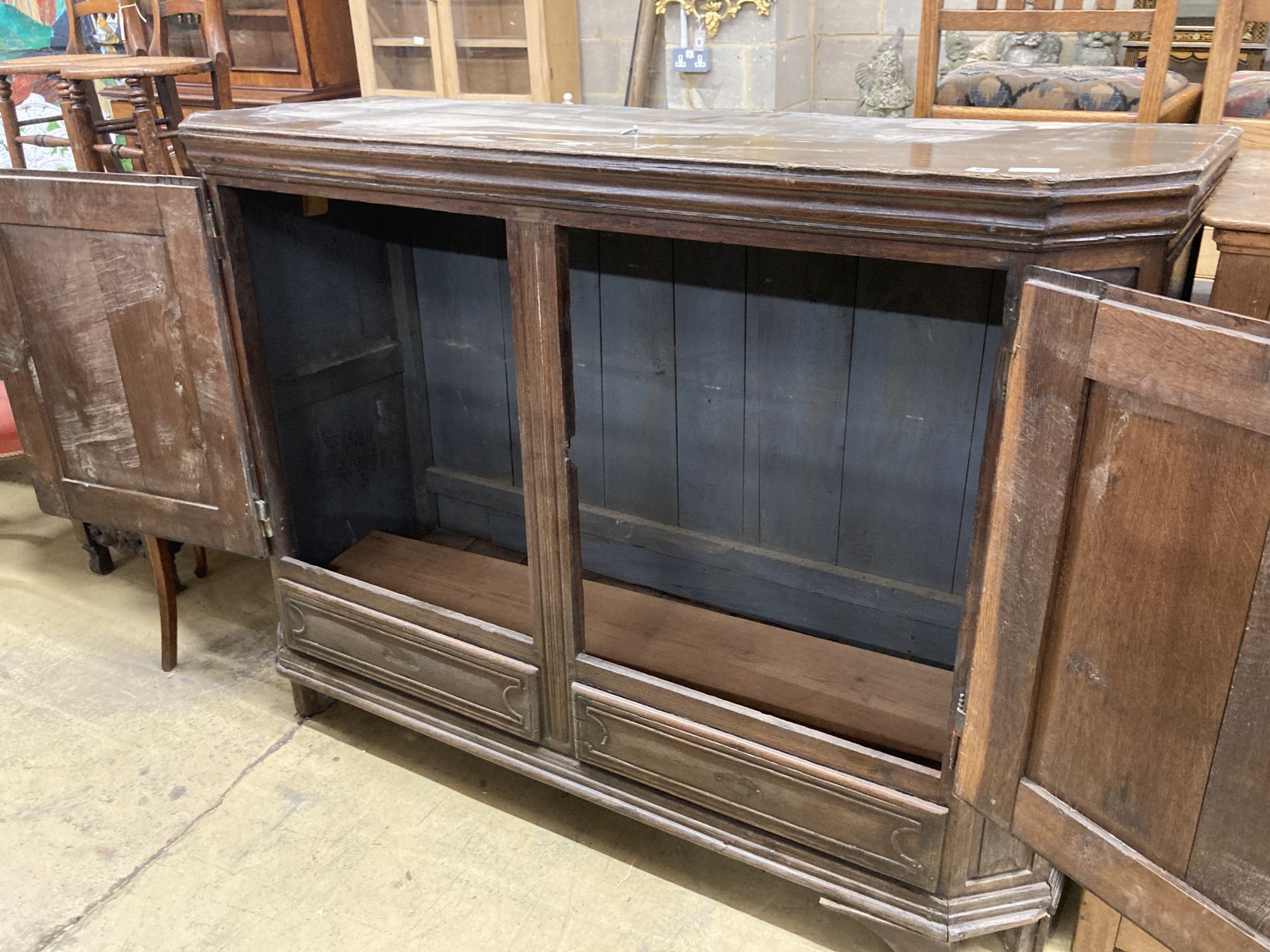 A Dutch oak two door cabinet, width 170cm, depth 60cm, height 124cm